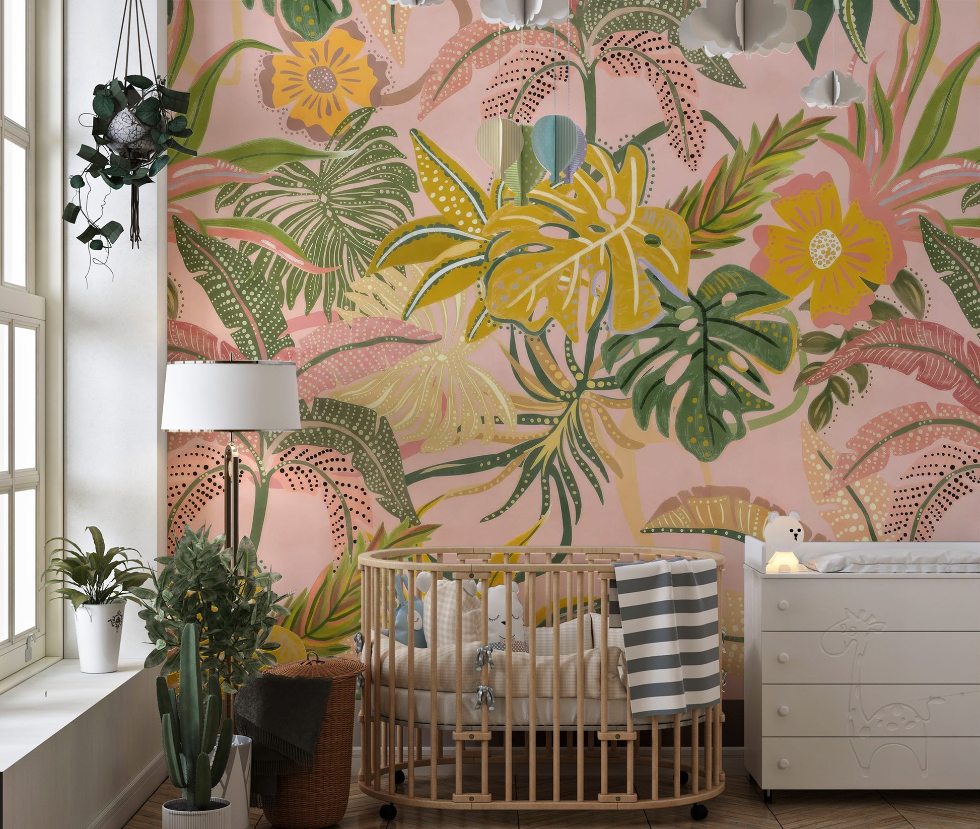 Large scale vibrant watercolor tropical leaf wallpaper in a living room setting.