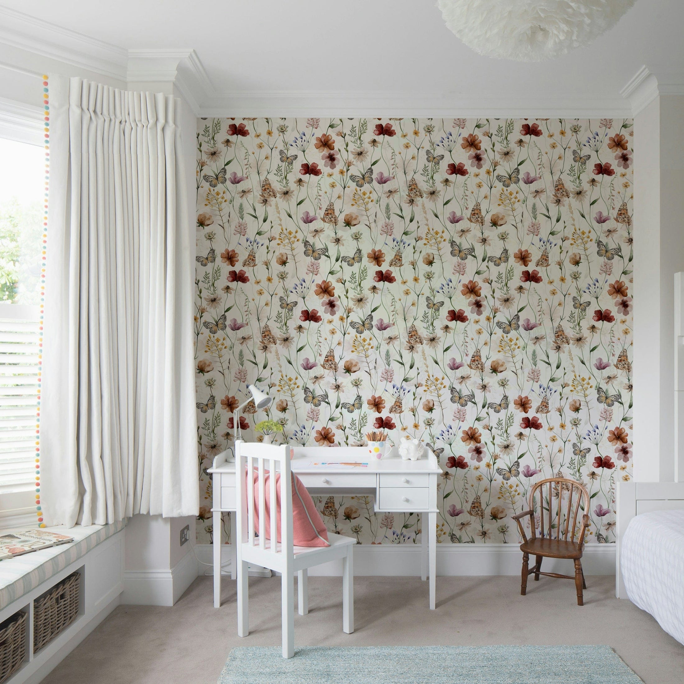 Scandinavian style watercolor wildflower meadow wallpaper with butterflies.